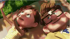 Young Carl and Ellie lying on the grass
