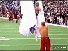 Jerry Rice jumps through Cowboys Cheerleaders