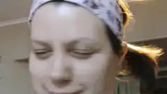 Woman shaking head and smiling