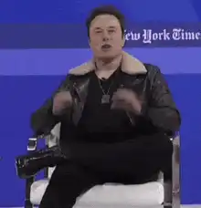 Elon Musk gesturing with GF text