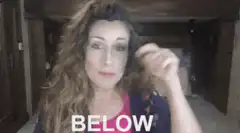 Woman pointing down with text below