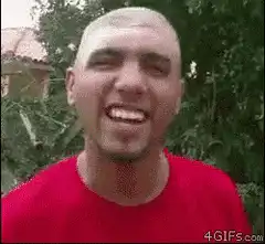 Bald man laughing and turning head