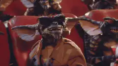 Gremlins watching a movie