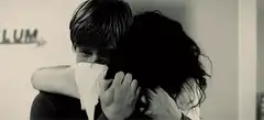 teen couple hugging in sepia