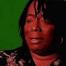 Woman with dreadlocks looking surprised