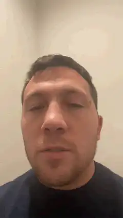 Man looking up and blinking
