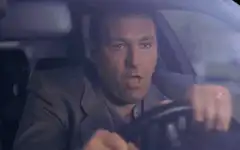 Adam Sandler driving and talking
