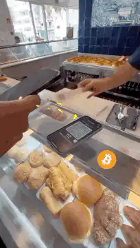 Customer pays with Bitcoin at bakery