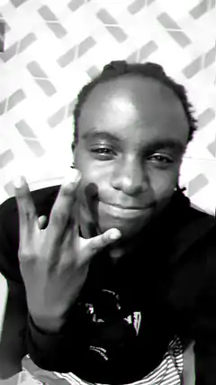 man holding up three fingers