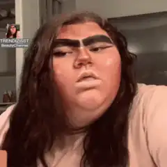 Woman with thick eyebrows and blush
