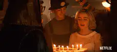 Chloe blowing out birthday candles
