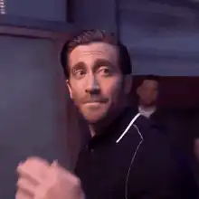 Jake Gyllenhaal blowing a kiss and walking away