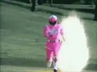 Pink Ranger running through explosions