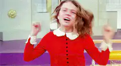 girl in red dress screaming excitedly