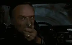 Hannibal Lecter drinks and stares