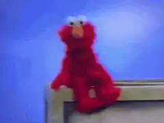 Elmo slides down and disappears