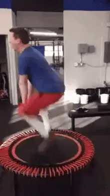 Man jumping on mini trampoline