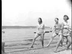 women dancing on beach vintage