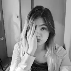 woman covering one eye with hand