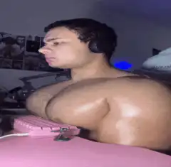 Muscular man with large chest flexing