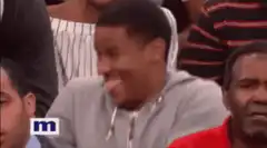 Man in grey hoodie laughing