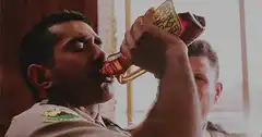 Officer drinking from a bottle