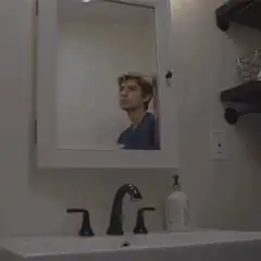 Austin Butler looking in the mirror