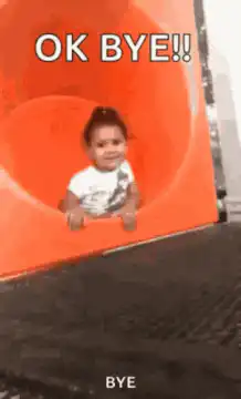 Baby slides down orange tube