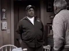 Archie Bunker pulls out two spoons