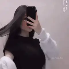 Girl flipping hair in mirror selfie