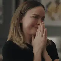 Woman praying with hands clasped