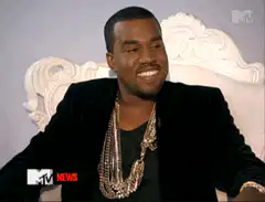 Kanye West smiling then looking serious