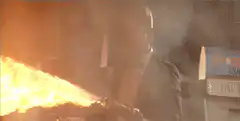Man with flamethrower in suit