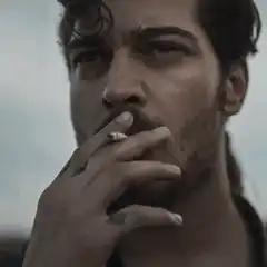 Man smoking cigarette close up