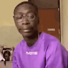 Man removes glasses and looks up
