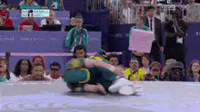 Judo athlete does a backflip on the mat