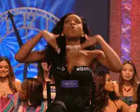 Loni Love gestures on stage