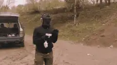 Man shooting gun with smoke
