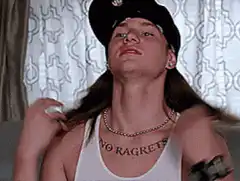 Woman showing off no regrets tattoo