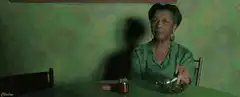 Woman eating salad with shadow