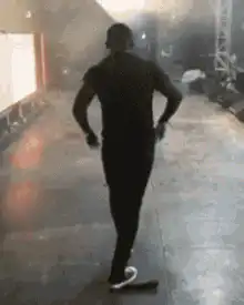 Man dancing on stage with crowd