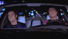Jim Carrey and Matthew Lillard singing in a car