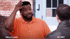 Troy Brown scratches head then bows