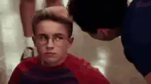 Boy getting head patted