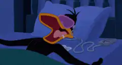 Daffy Duck snoring loudly in bed