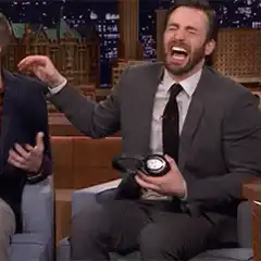 Chris Evans laughing hysterically on a talk show