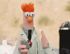 Bunsen Honeydew holding a beaker