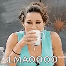 Woman laughing and spitting out coffee