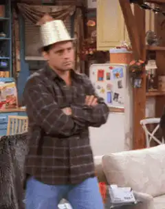Joey wearing a party hat