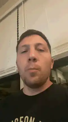 Man chewing with mouth open